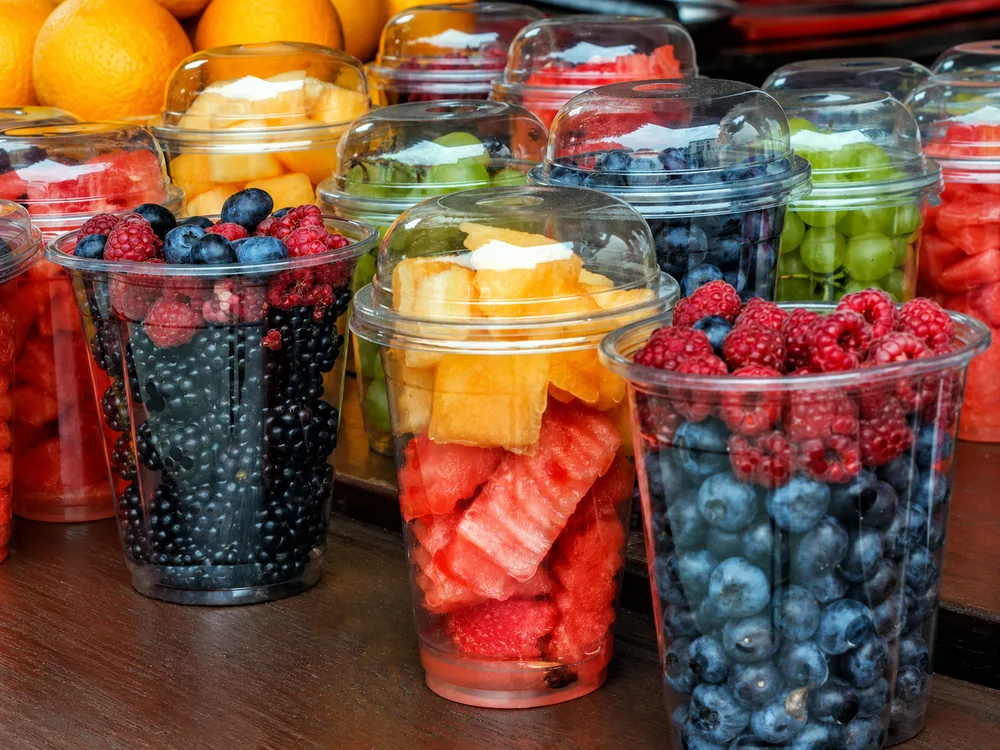 Fresh-cut fruit served in clear plastic cups for ready-to-eat convenience