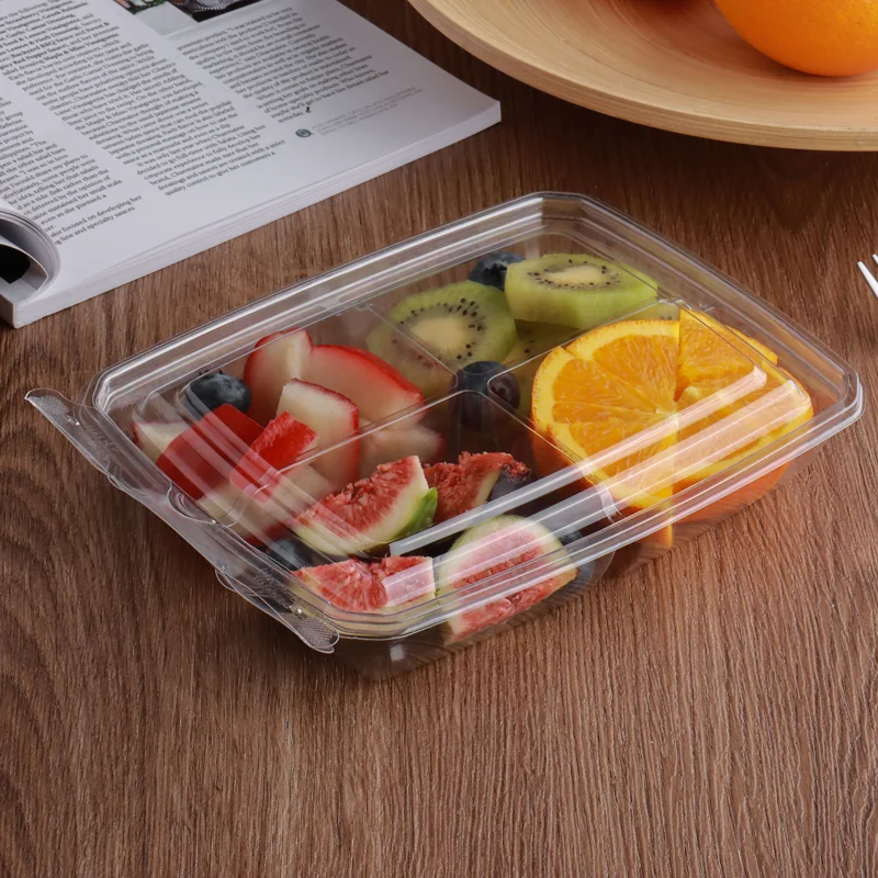 Clear PET tamper-evident clamshell container filled with fresh-cut fruit