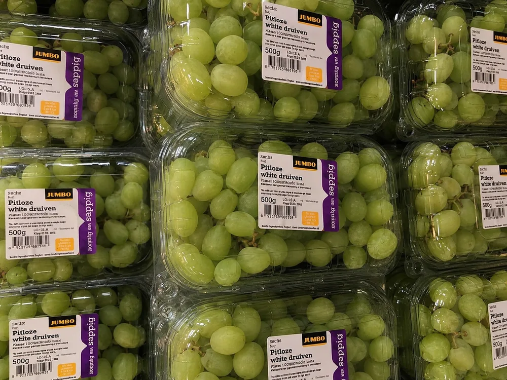 Grapes packed in clear PET clamshell containers for retail sale