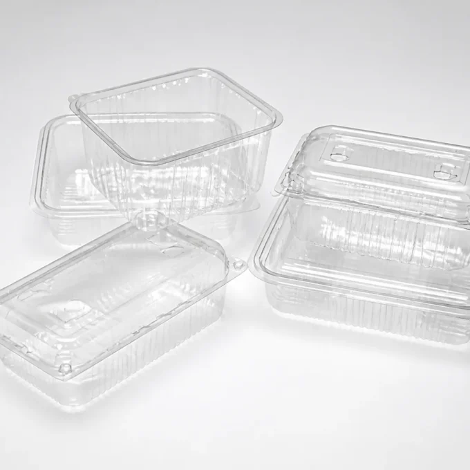 Assortment of clear PET containers for fresh and cold foods.