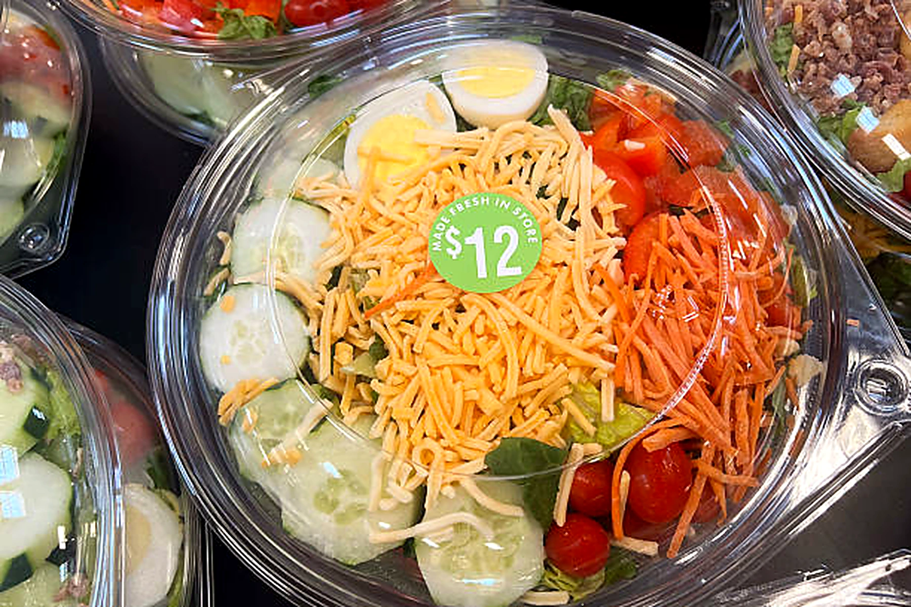 Clear plastic deli salad container with lid