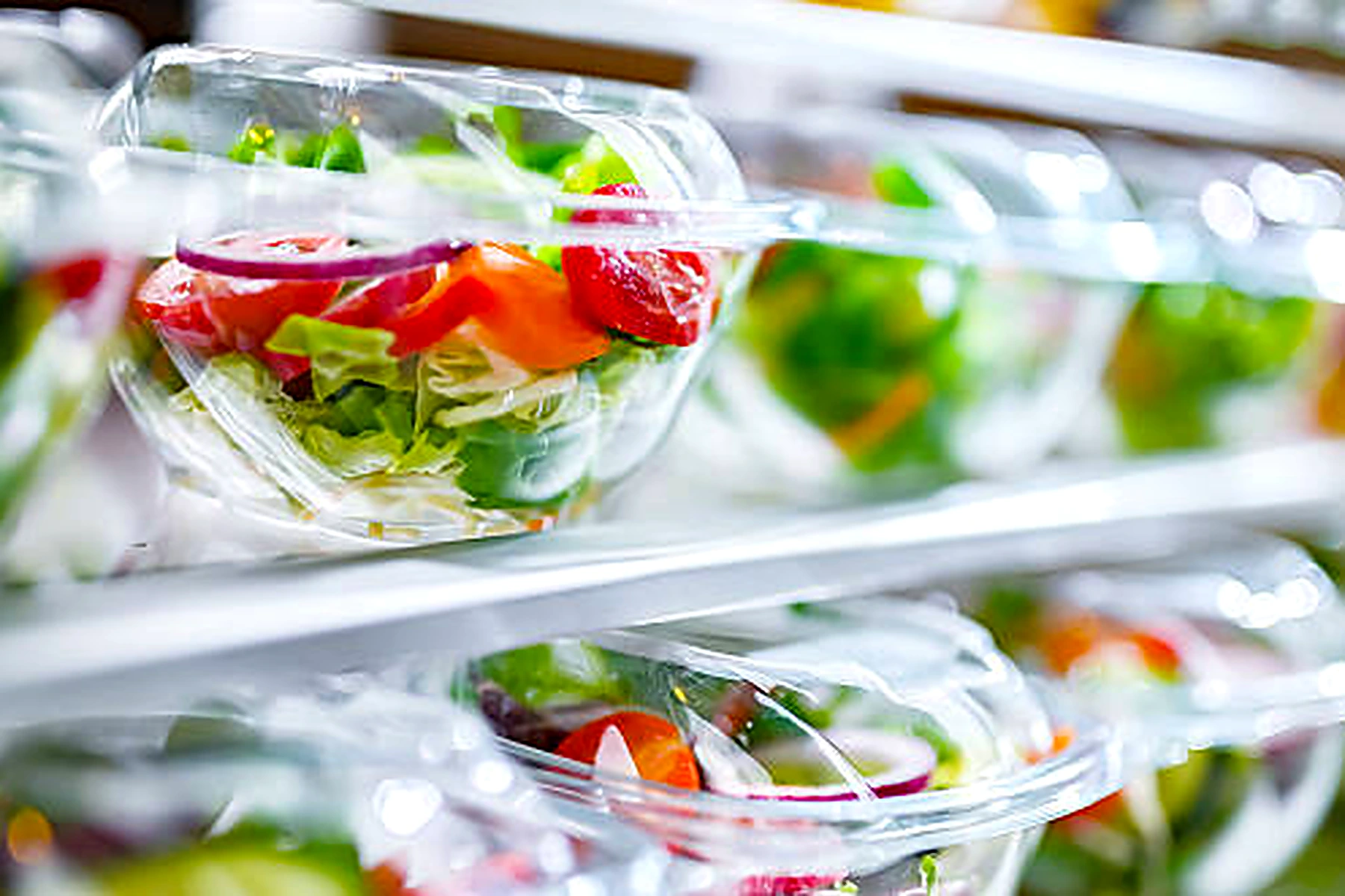 Plastic fresh salad containers on retail display