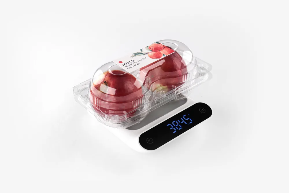 STL-AP2C 2-cavity apple clamshell container holding two fresh apples (white bg)