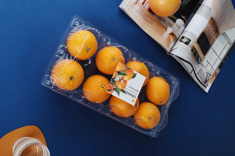 STL-AP8S 8-cavity fruit clamshell container holding eight fresh fruits (scene)