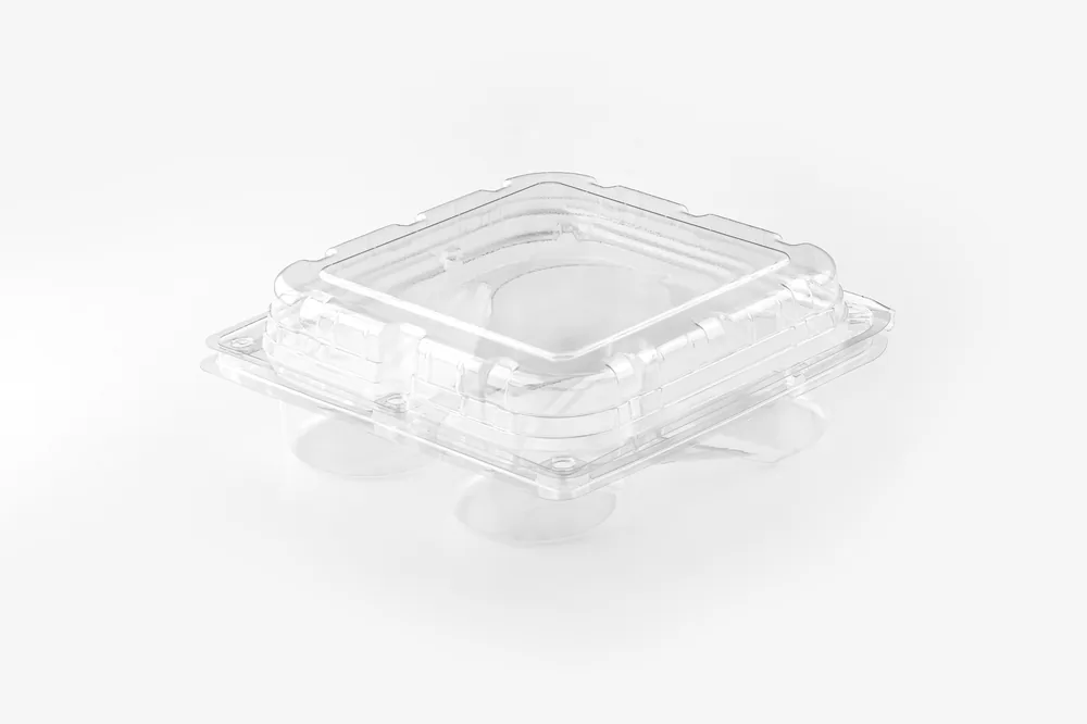 STL-L04 4-cavity fruit clamshell container holding four fresh fruits (white bg)