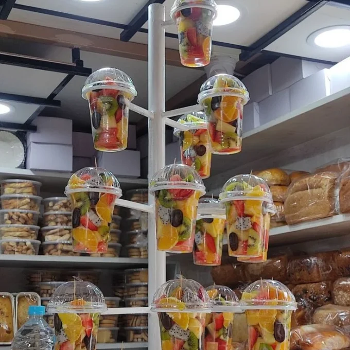 Clear cups displaying packaged fresh-cut fruit for retail.