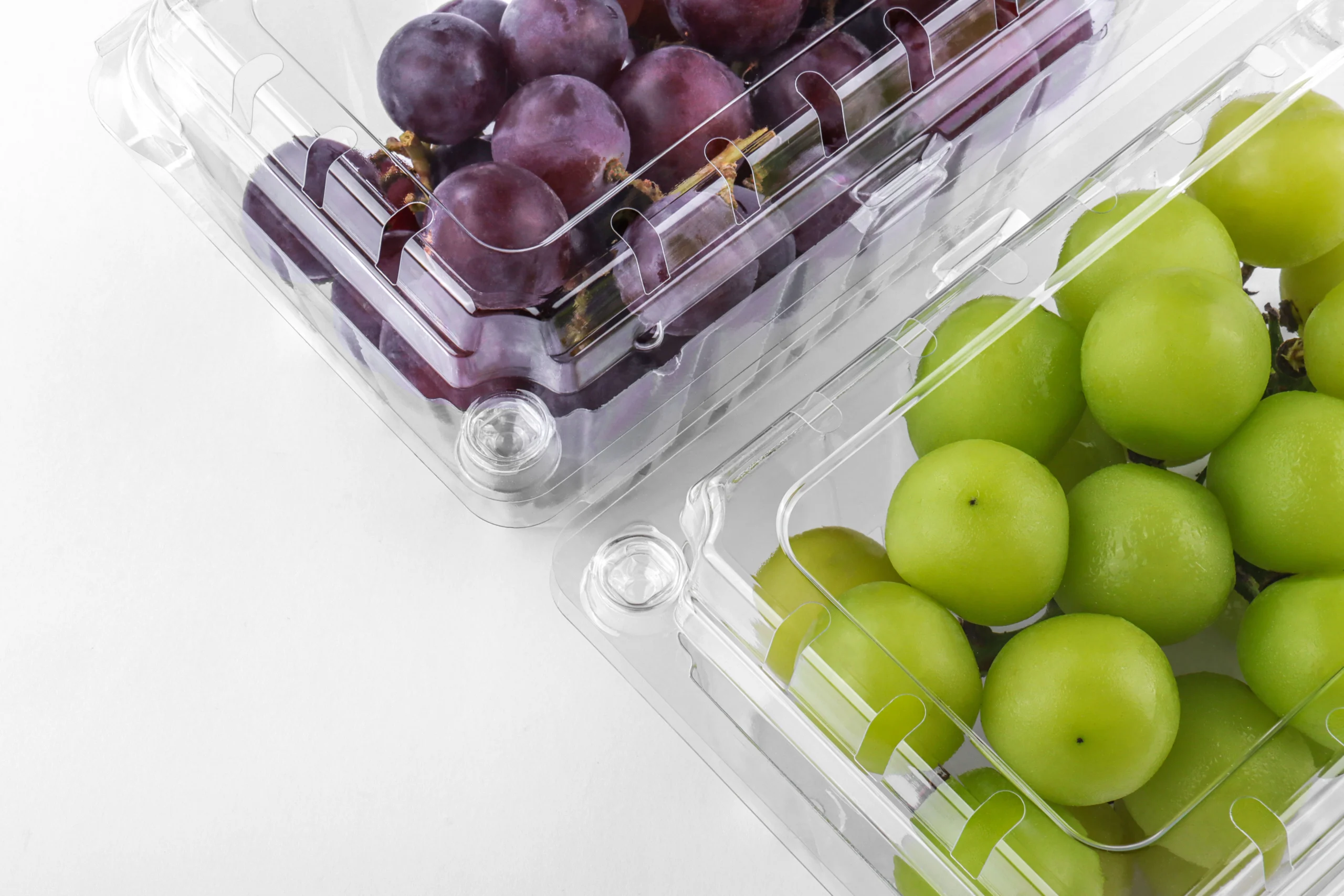 Hinged-lid clamshell container designed for fresh grapes.