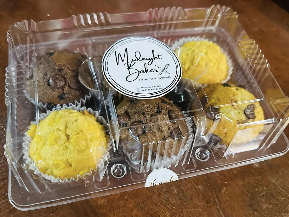Midnight Baker pastries packed in a clear PET bakery clamshell container with branded label