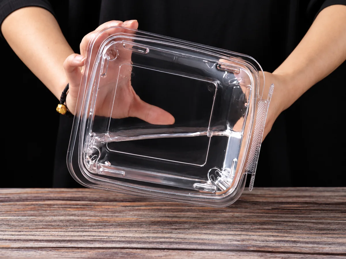 Evaluating a clear PET food container prototype before production