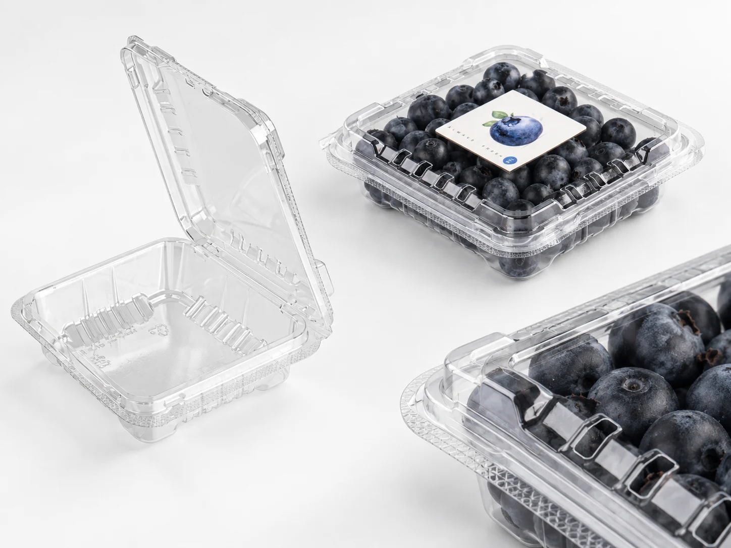 Clear PET blueberry clamshells shown empty, filled and labelled